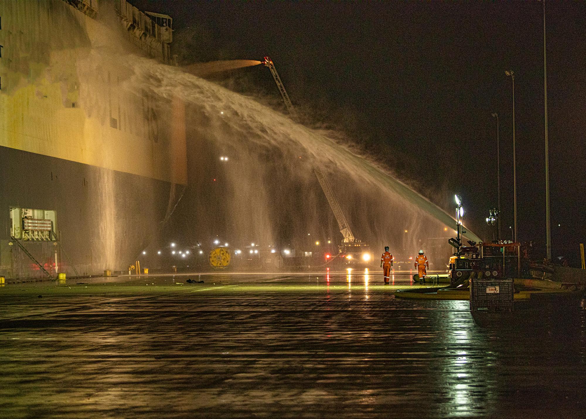 Firefighting crews spraying a car carrier during 24-hour Jacksonville OPA-90 response